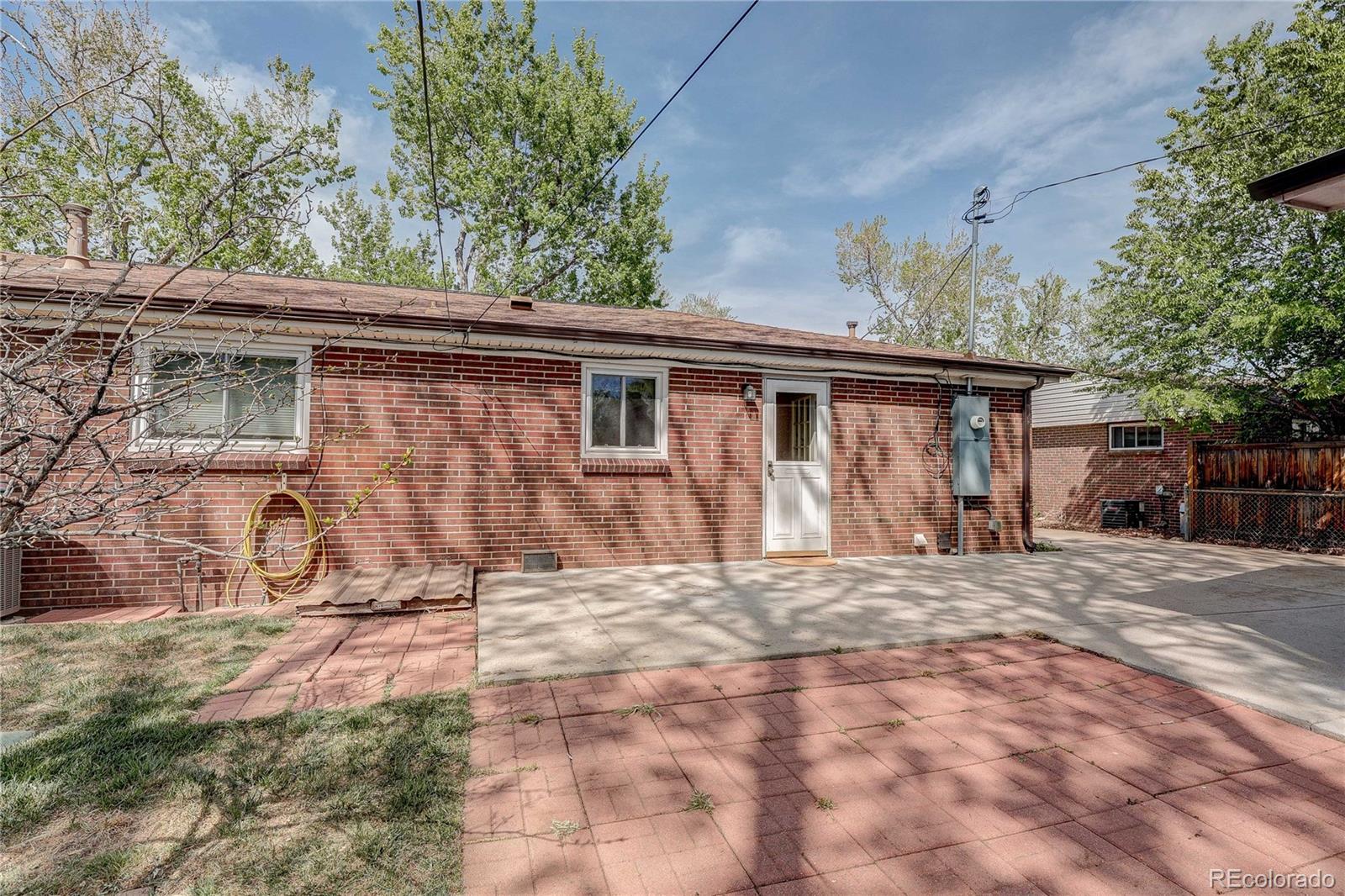 4570 Field Street Wheat Ridge, CO 80033 - Photo 26 of 44 a view of a house with a yard
