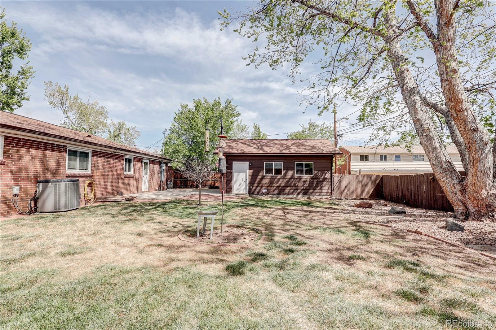4570 Field Street Wheat Ridge, CO 80033 - Photo 28 of 44 a view of a house with trees in the background