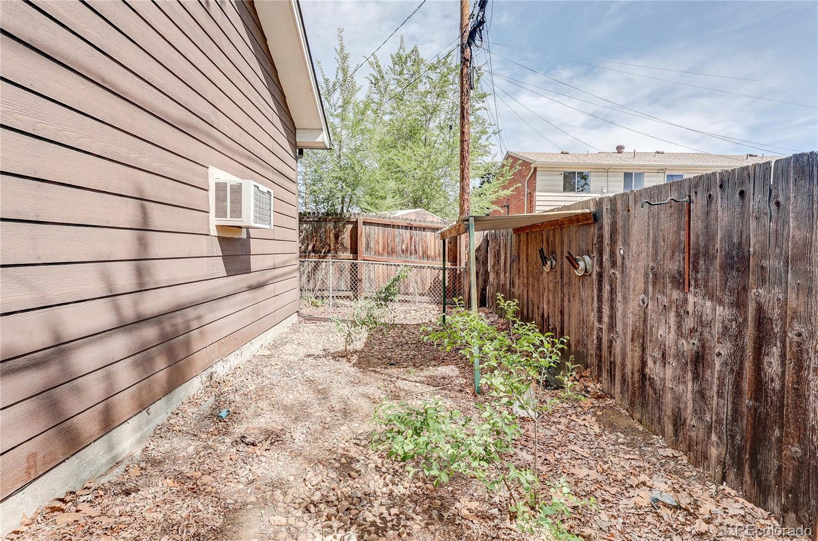 4570 Field Street Wheat Ridge, CO 80033 - Photo 32 of 44 a view of a backyard with pathway