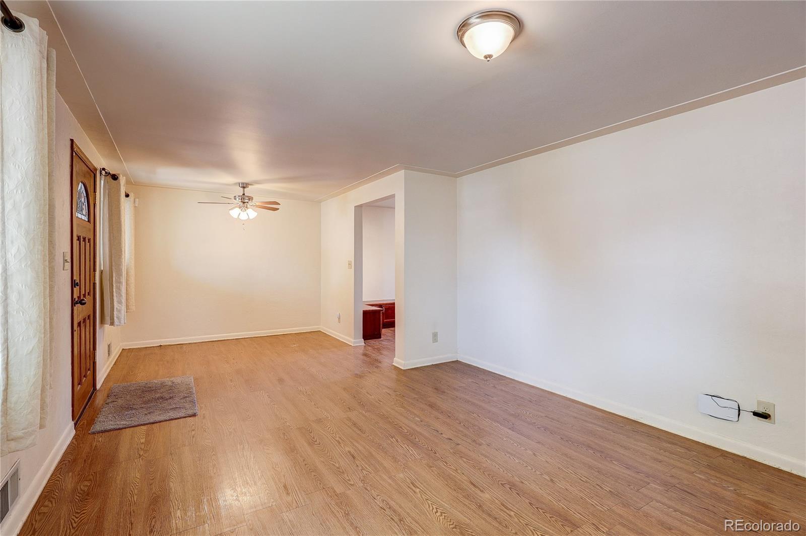 4570 Field Street Wheat Ridge, CO 80033 - Photo 8 of 44 wooden floor in an empty room