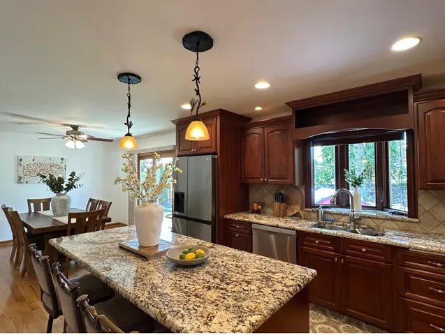 a kitchen with a table and chairs in it