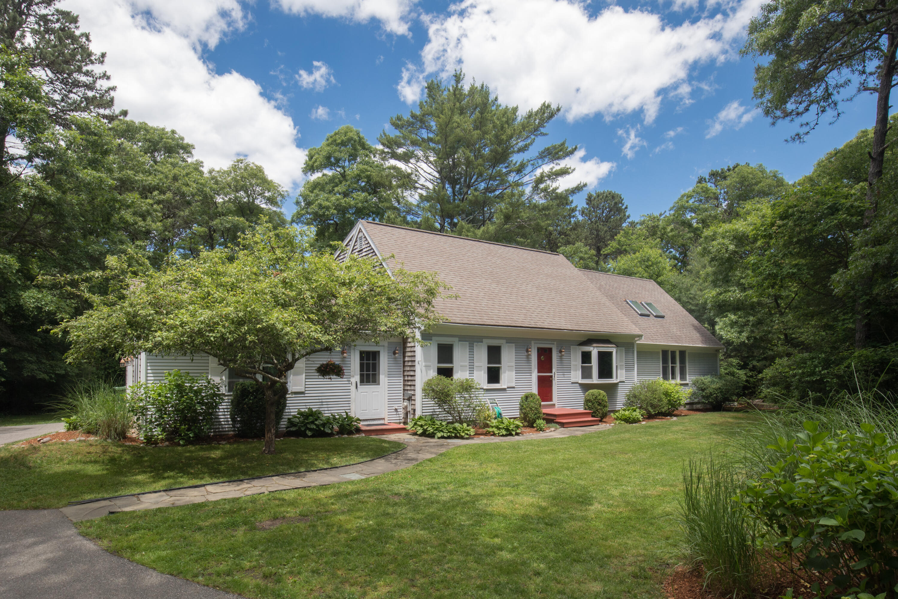 25 Weathervane Way Marstons Mills, MA 02632 - Photo 1 of 21 a front view of a house with a garden
