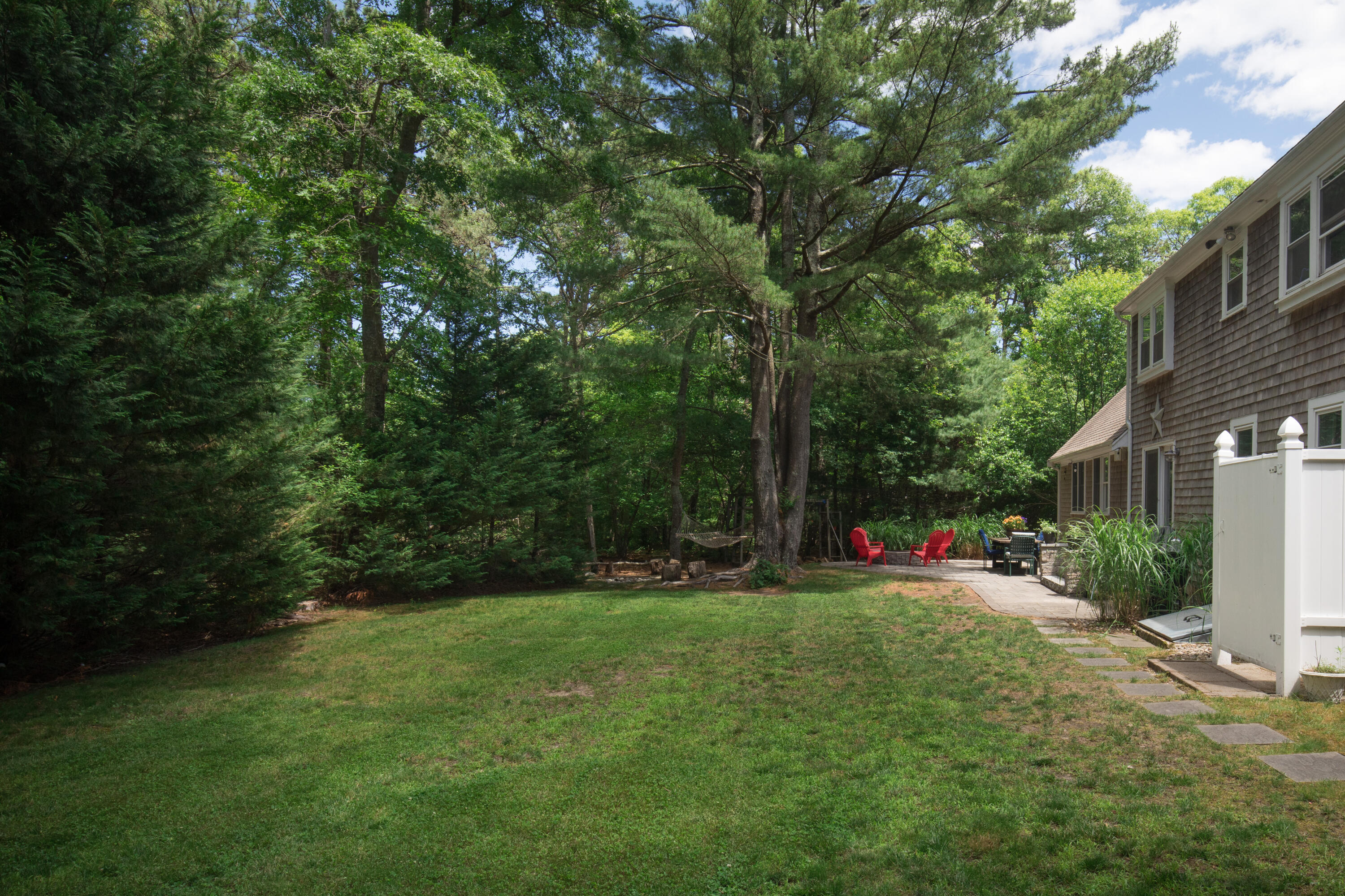 25 Weathervane Way Marstons Mills, MA 02632 - Photo 14 of 21 a view of a street with a bench and trees