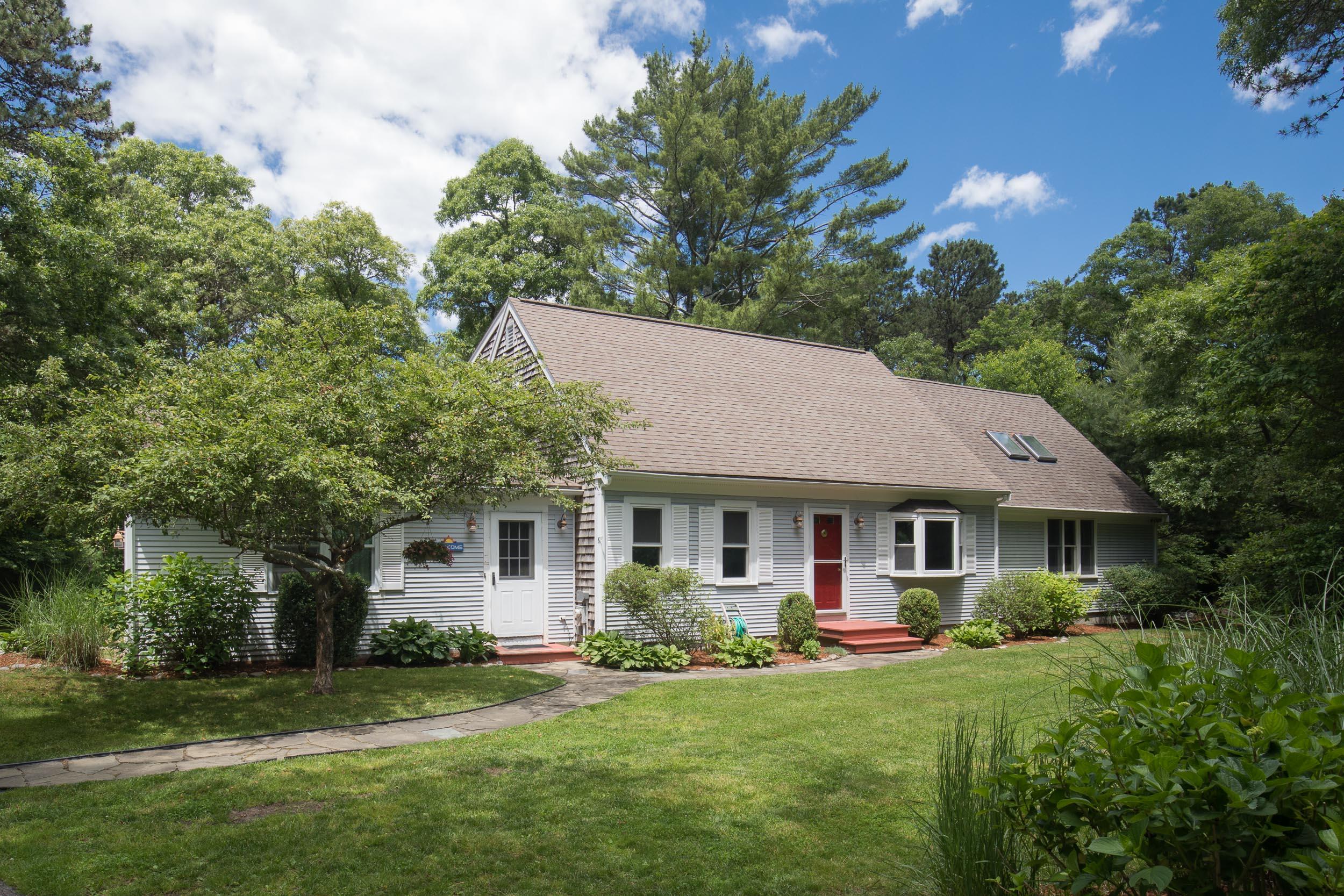 25 Weathervane Way Marstons Mills, MA 02632 - Photo 21 of 21 a front view of a house with a garden