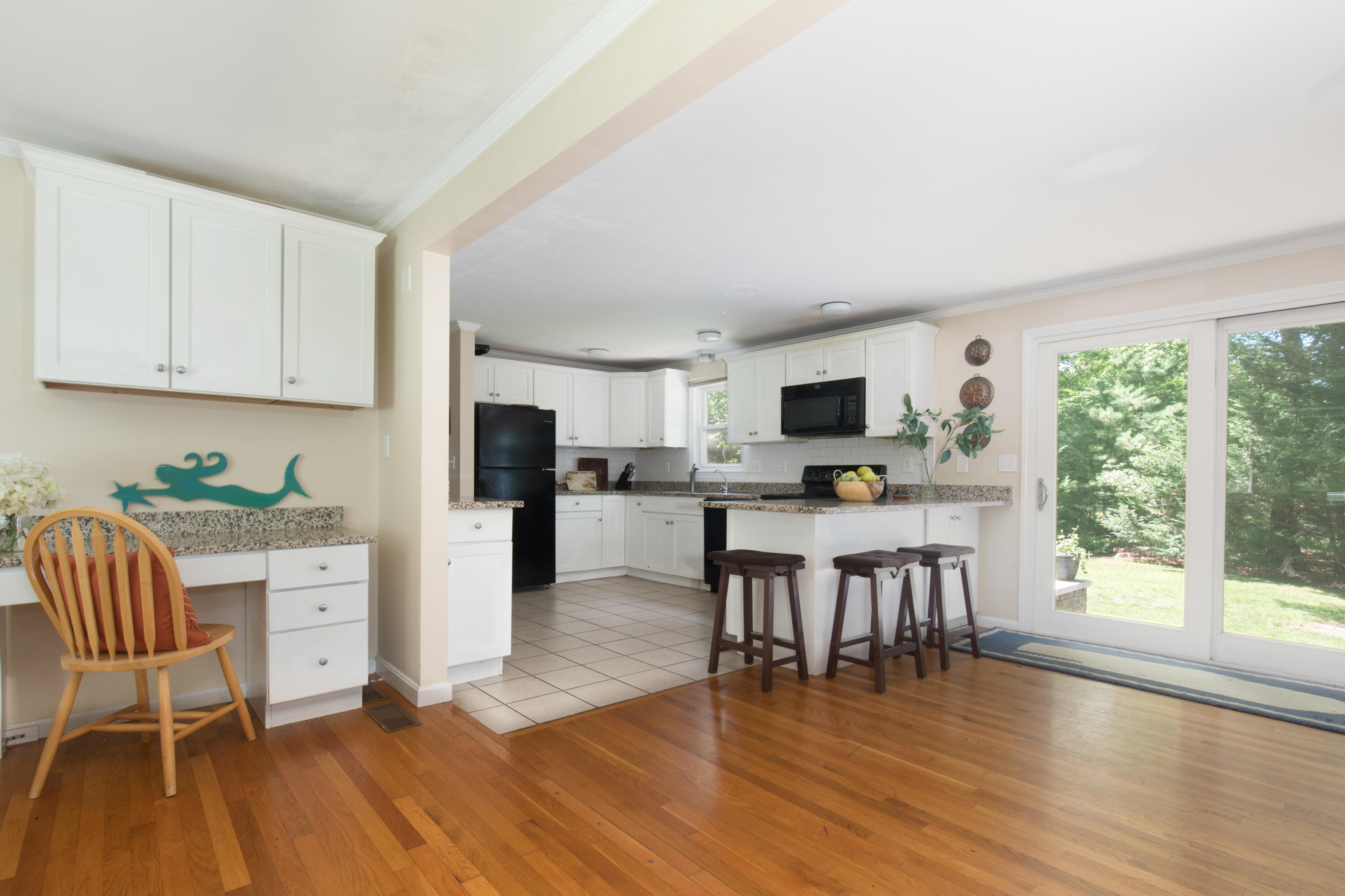 25 Weathervane Way Marstons Mills, MA 02632 - Photo 5 of 21 a view of kitchen with microwave and wooden floor