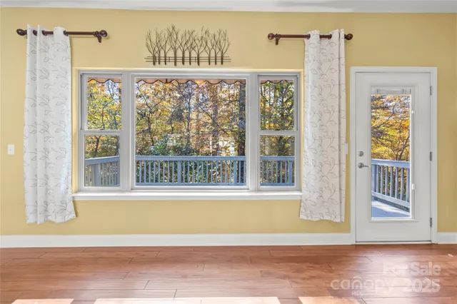 a view of a porch with a floor to ceiling window