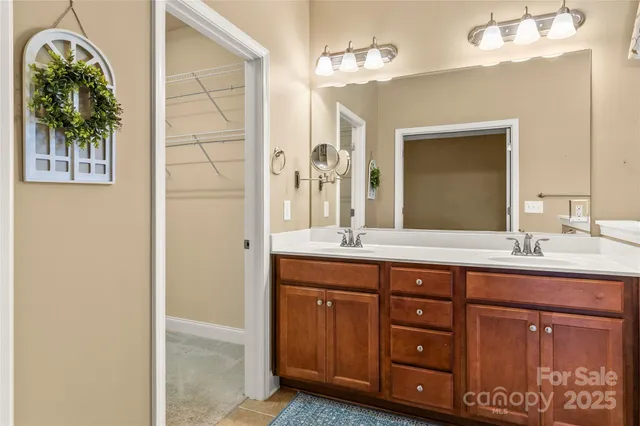 a bathroom with a shower and a glass door