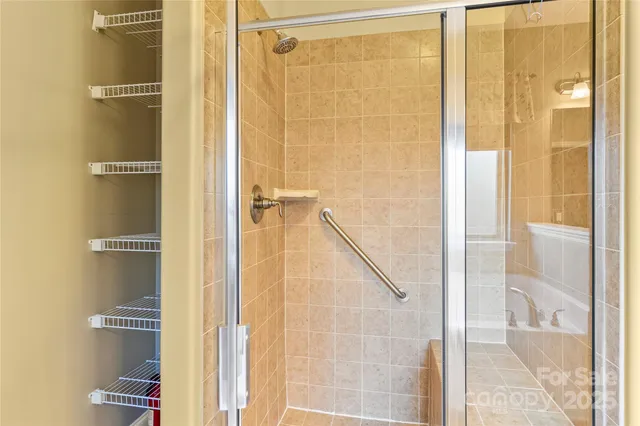 a bathroom with a bathtub sink and mirror