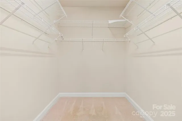 a view of a hallway with washer and dryer