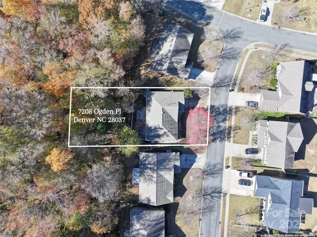 a kitchen with stainless steel appliances granite countertop a sink and a refrigerator