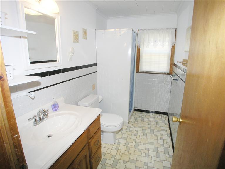 26 Edwards Road Dennis Port, MA 02639 - Photo 14 of 14 a bathroom with a sink a toilet and shower