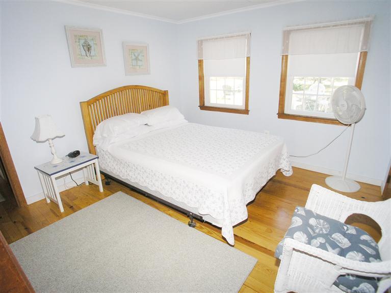 26 Edwards Road Dennis Port, MA 02639 - Photo 9 of 14 a bedroom with a bed and a window
