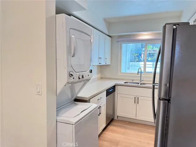 a kitchen with a sink stove and refrigerator