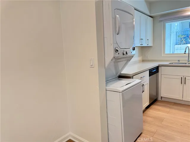 a kitchen that has a sink and a stove in it