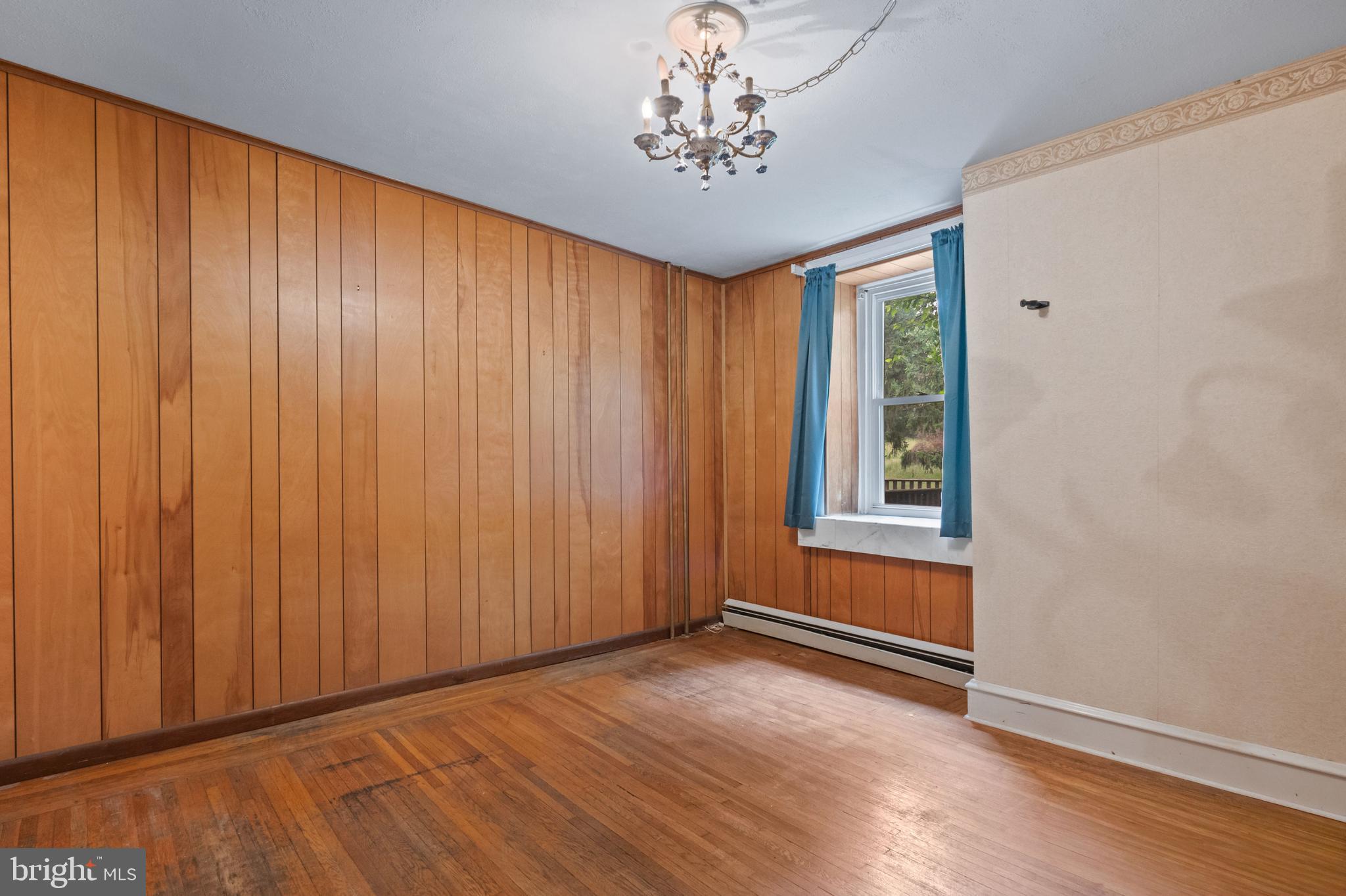 564 Blandon Road Fleetwood, PA 19522 - Photo 12 of 45 an empty room with wooden floor and windows