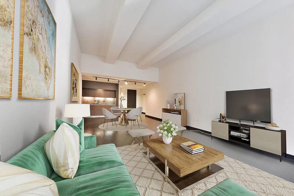20 Pine Street, Unit 910 Manhattan, NY 10005 - Photo 2 of 17 a living room with furniture and a flat screen tv
