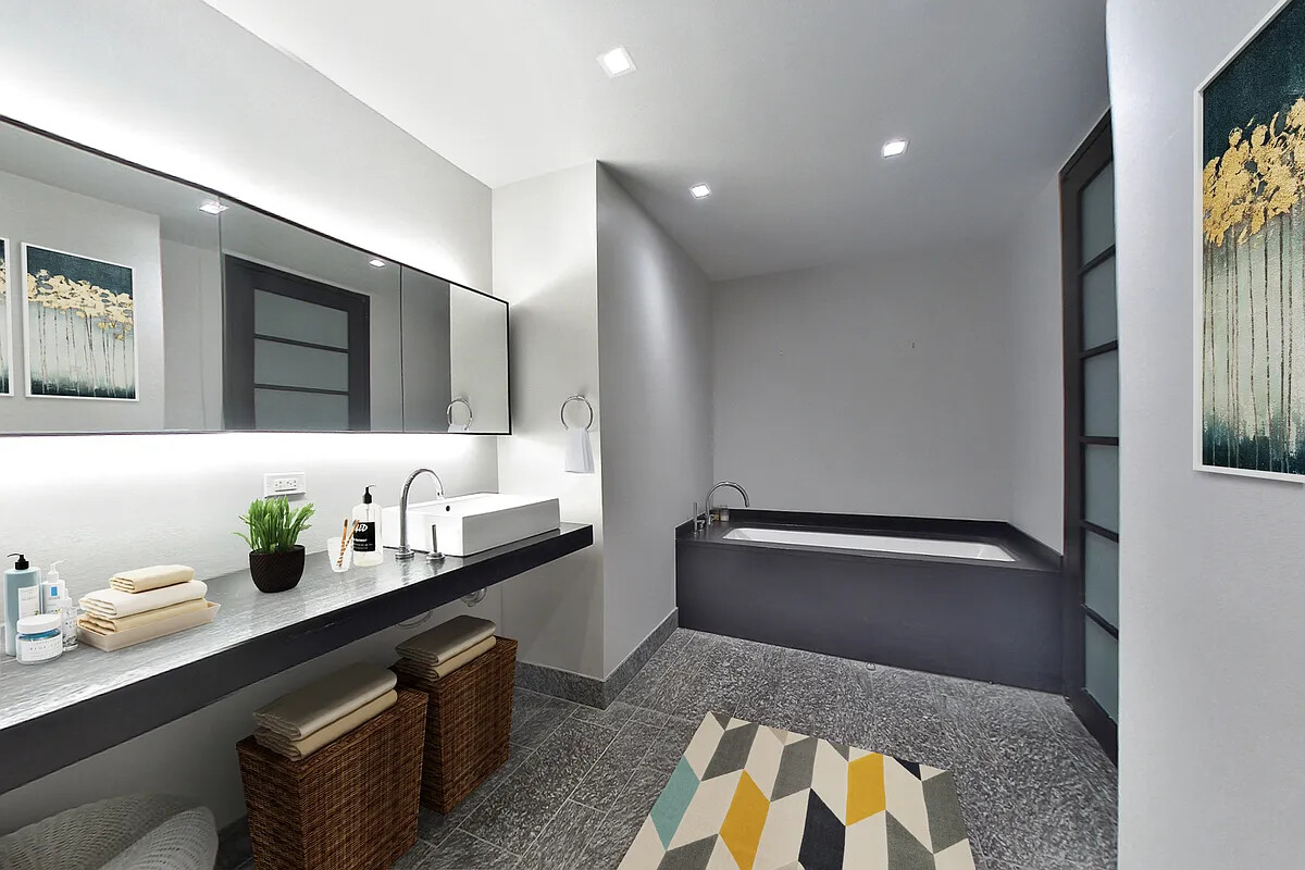 20 Pine Street, Unit 910 Manhattan, NY 10005 - Photo 5 of 17 a bathroom with a sink double vanity and a mirror