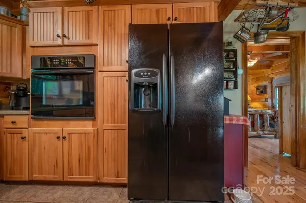 a kitchen with stainless steel appliances granite countertop a refrigerator and a stove