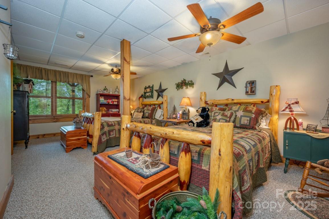 186 Black Ridge Drive Bostic, NC 28018 - Photo 27 of 47 a bed room with furniture and a chandelier