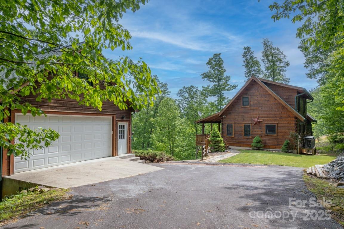 186 Black Ridge Drive Bostic, NC 28018 - Photo 3 of 47 a view of a house with a yard and large trees