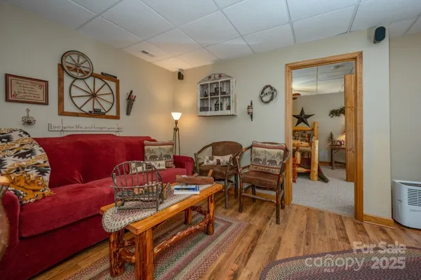 a bathroom with a toilet and a shower curtain