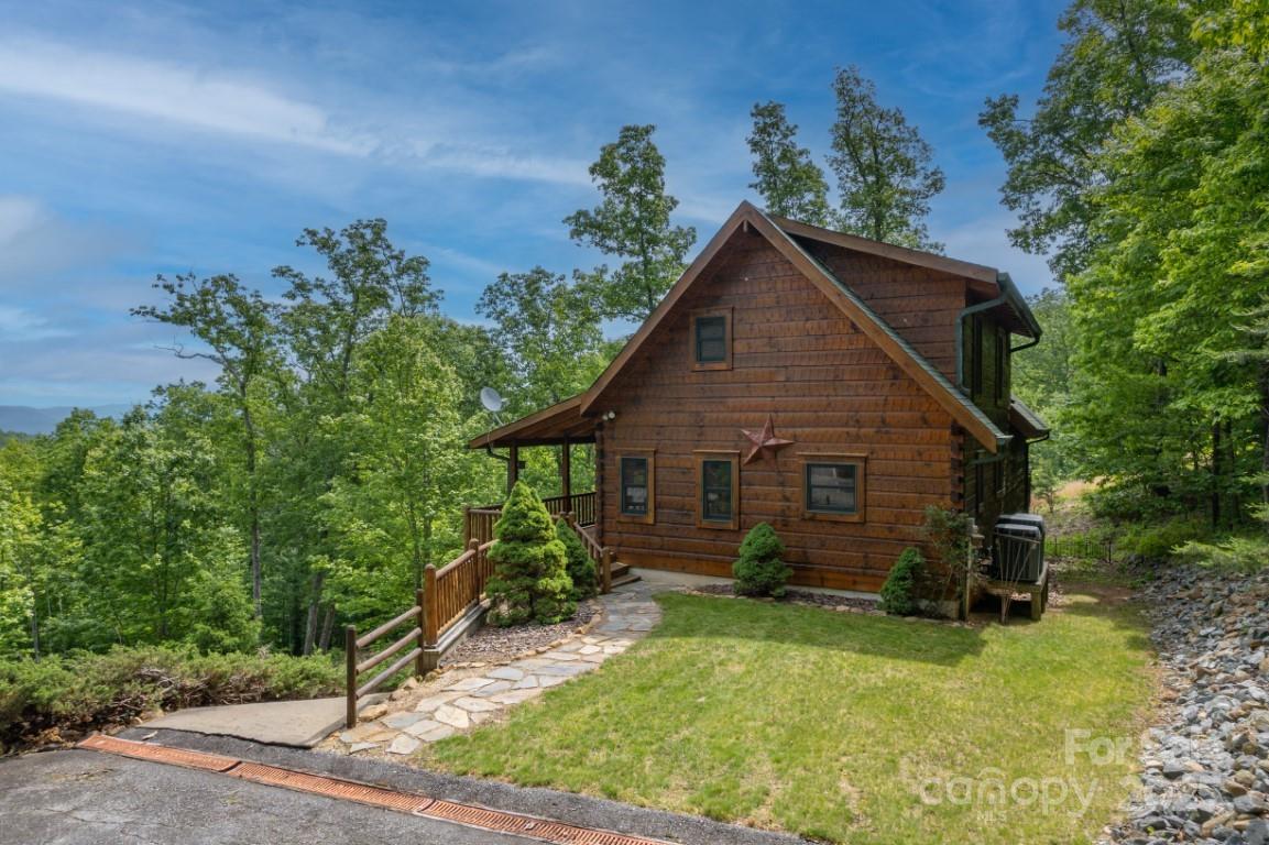 186 Black Ridge Drive Bostic, NC 28018 - Photo 6 of 47 a view of a house with wooden fence and garden