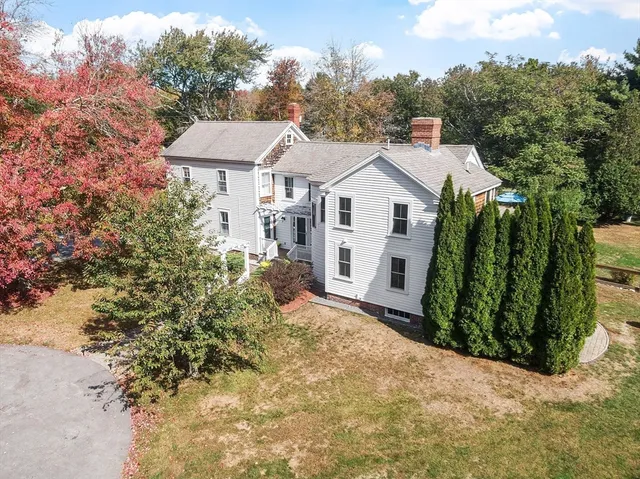 a view of a house with a small yard and plants