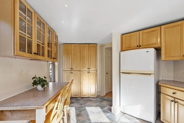 a view of kitchen with a refrigerator washer and dryer