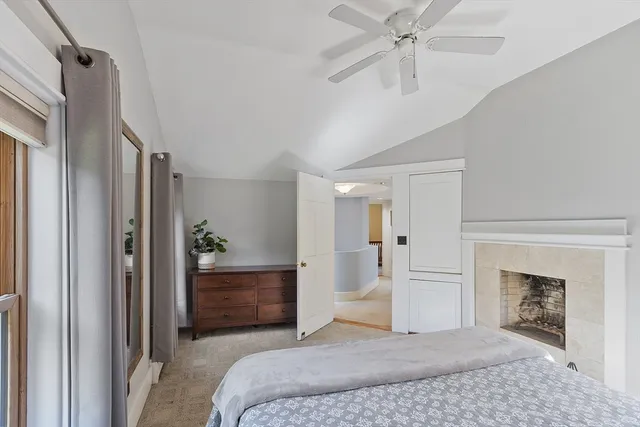 a bedroom with a bed and a view of bathroom