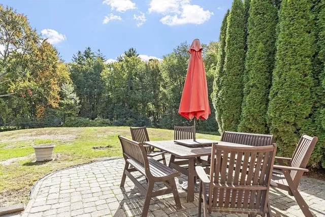 a view of a dining table and chairs in the patio