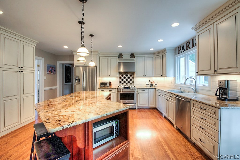 2600 Arrandell Road Midlothian, VA 23113 - Photo 19 of 45 a kitchen with stainless steel appliances granite countertop a sink stove and refrigerator