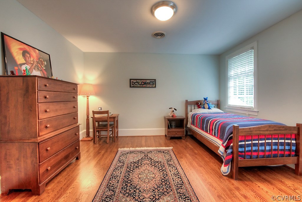 2600 Arrandell Road Midlothian, VA 23113 - Photo 29 of 45 a bedroom with a bed and wooden floor