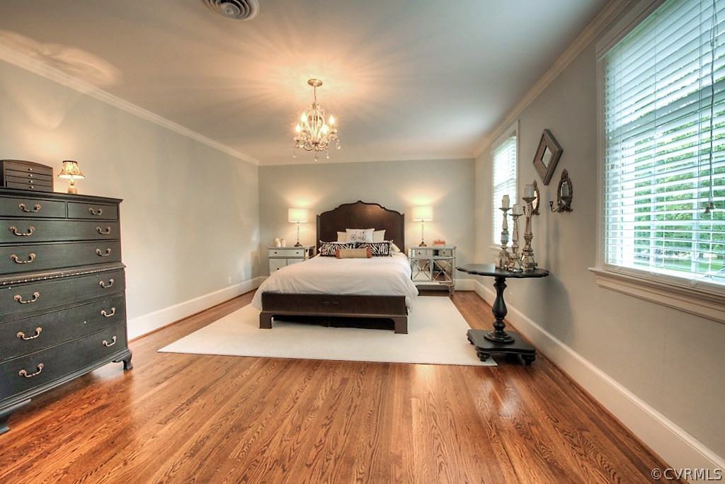 2600 Arrandell Road Midlothian, VA 23113 - Photo 35 of 45 a bedroom with a bed and wooden floor