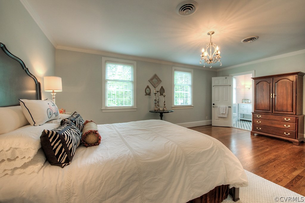 2600 Arrandell Road Midlothian, VA 23113 - Photo 36 of 45 a spacious bedroom with a bed a chandelier and a dresser