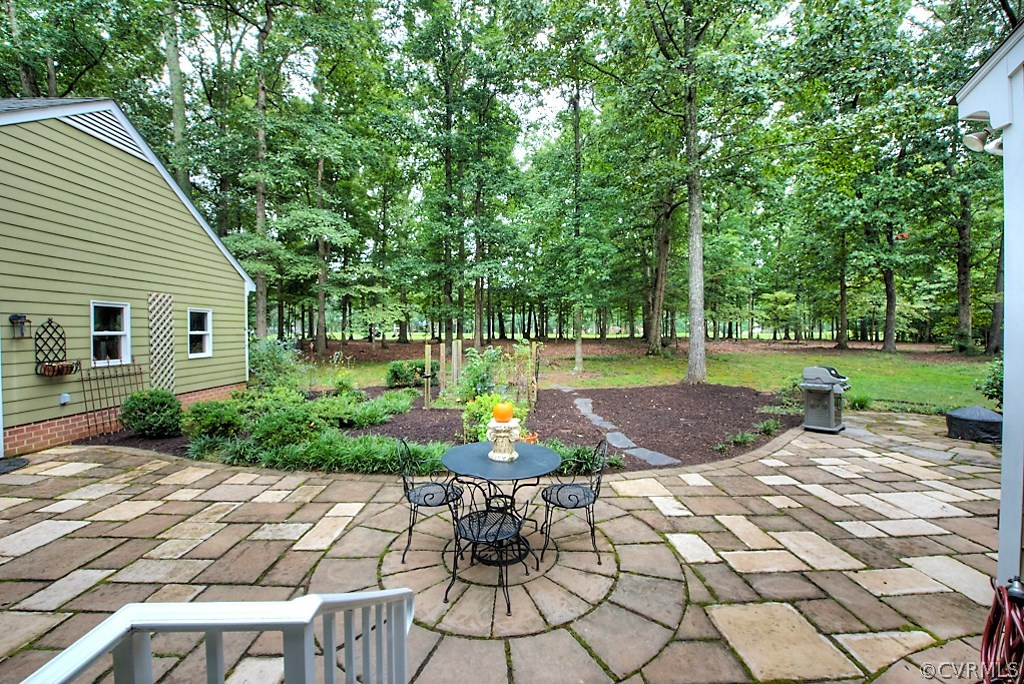 2600 Arrandell Road Midlothian, VA 23113 - Photo 39 of 45 a view of a patio with table and chairs and potted plants