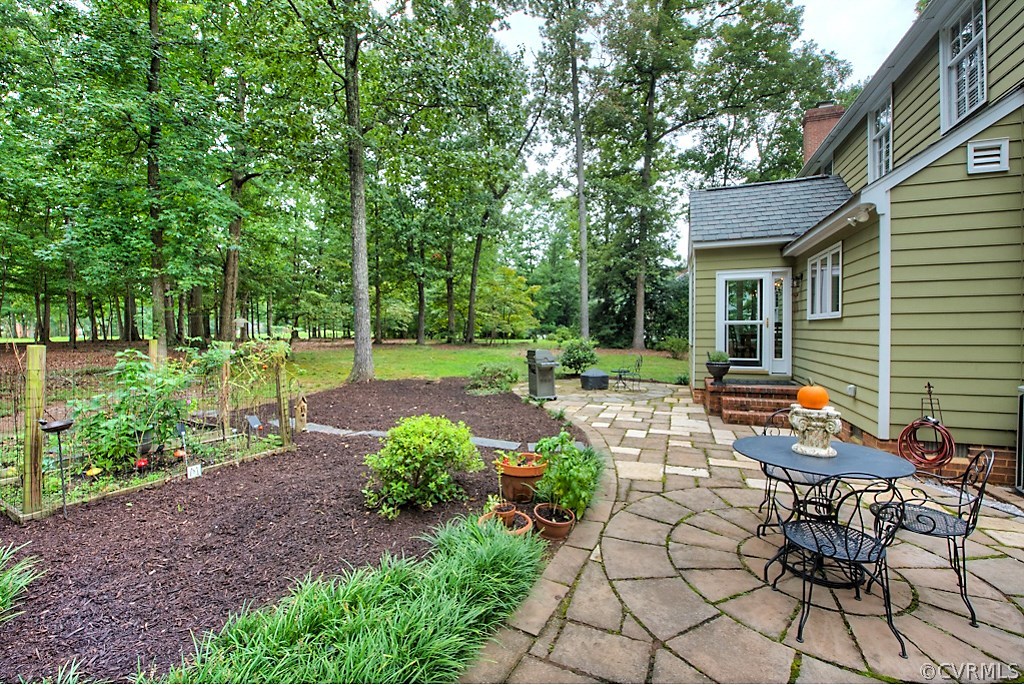 2600 Arrandell Road Midlothian, VA 23113 - Photo 41 of 45 a view of backyard with sitting area and garden