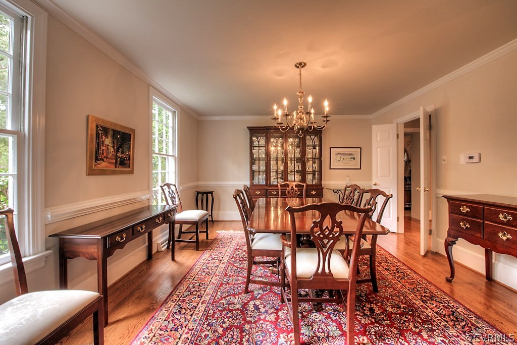 2600 Arrandell Road Midlothian, VA 23113 - Photo 9 of 45 a view of a dining room with furniture a chandelier and wooden floor