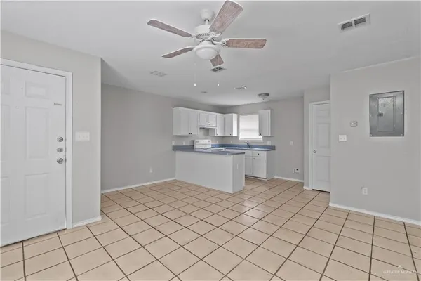 a view of kitchen cabinet and window