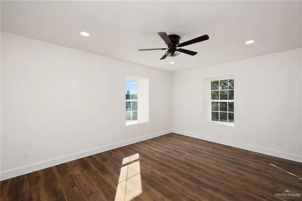 a view of a big room with wooden floor and closet