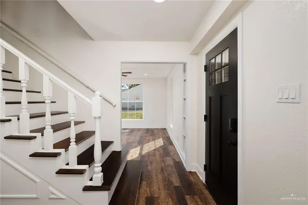 a view of front door with wooden floor