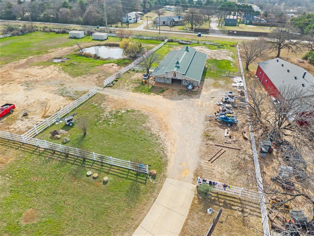 7260 Hudson Cemetery Road Mansfield, TX 76063 - Photo 39 of 40 Expansive property featuring multiple outbuildings, a natural pond, and perimeter fencing