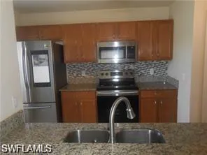 a kitchen with a stove and a microwave