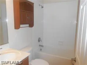 a bathroom with a toilet and a bathtub