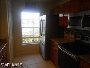 a kitchen with a stove and a microwave