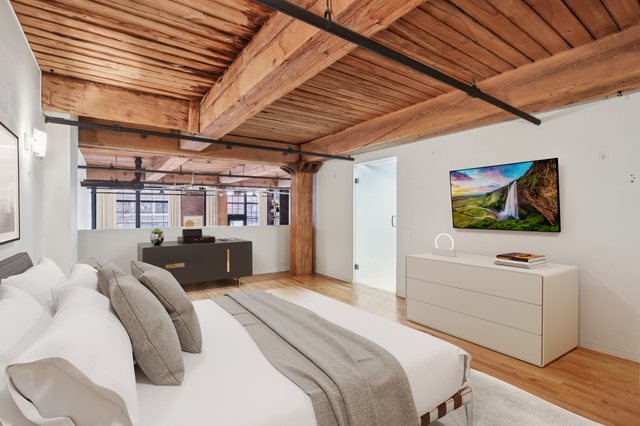 1000 West Washington Boulevard, Unit 137 Chicago, IL 60607 - Photo 13 of 33 a bed room with bed and a flat screen tv