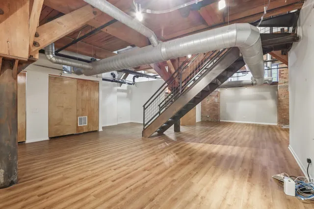 a view of an entryway with wooden floor