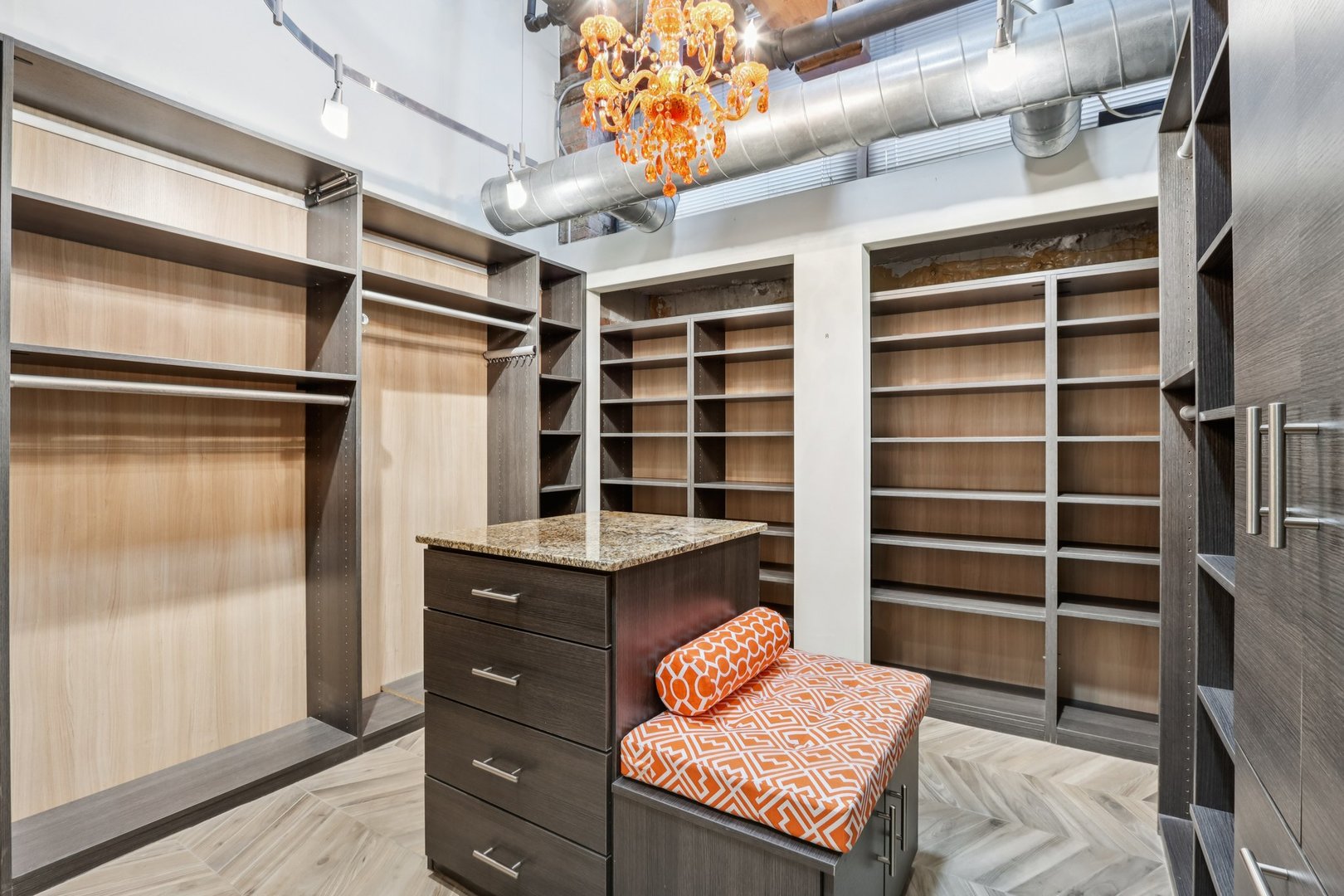 1000 West Washington Boulevard, Unit 137 Chicago, IL 60607 - Photo 22 of 33 a view of walk in closet and wooden shelves