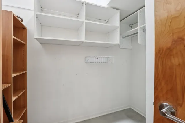 a view of an empty walk in closet