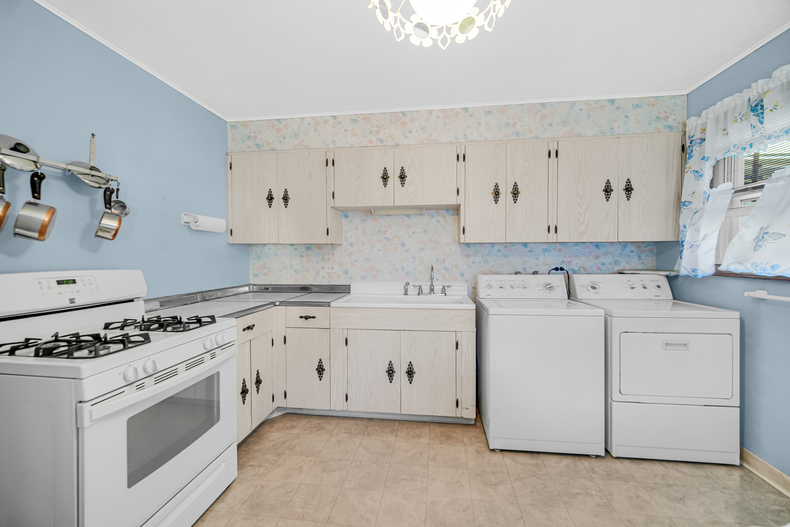 2800 School Drive Rolling Meadows, IL 60008 - Photo 7 of 23 a kitchen with cabinets appliances and a sink