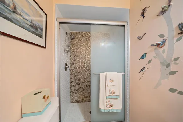 a view of a patio with table and chairs under an umbrella